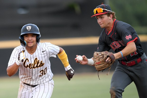 Crespi’s Nathan Toscano gets caught in a run down and...