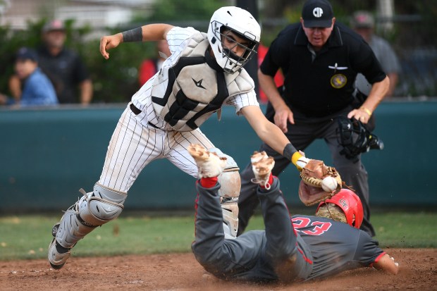 Mater Dei’s Ezekiel Lara steals home as Crespi catcher Ben...