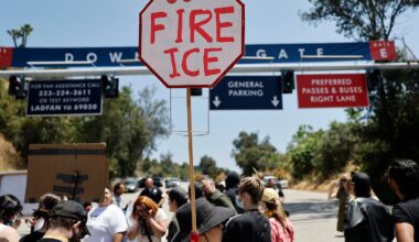 Protesters demonstrated not far from federal agents staged outside Dodger Stadium on Friday in Los Angeles.