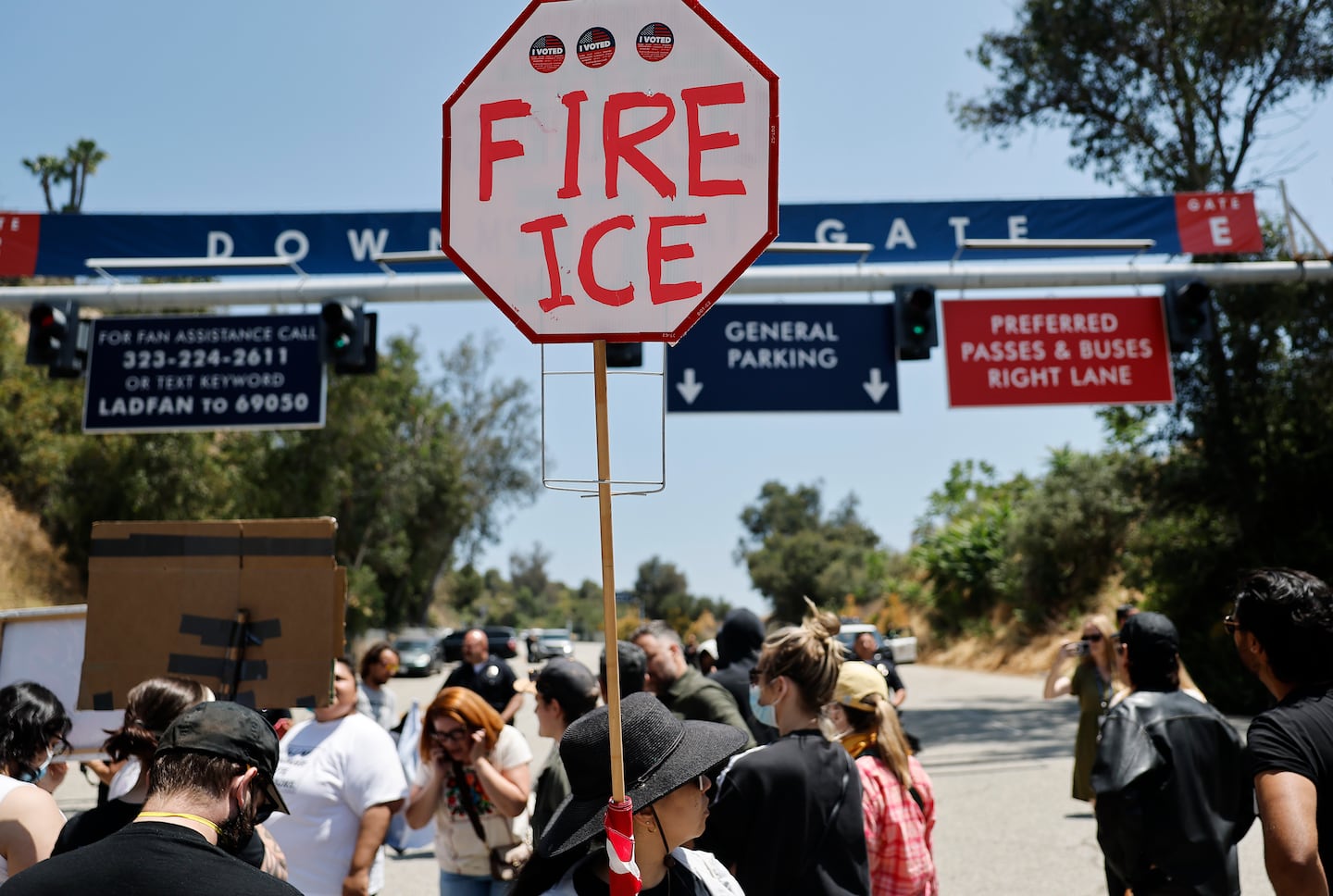 Protesters demonstrated not far from federal agents staged outside Dodger Stadium on Friday in Los Angeles.