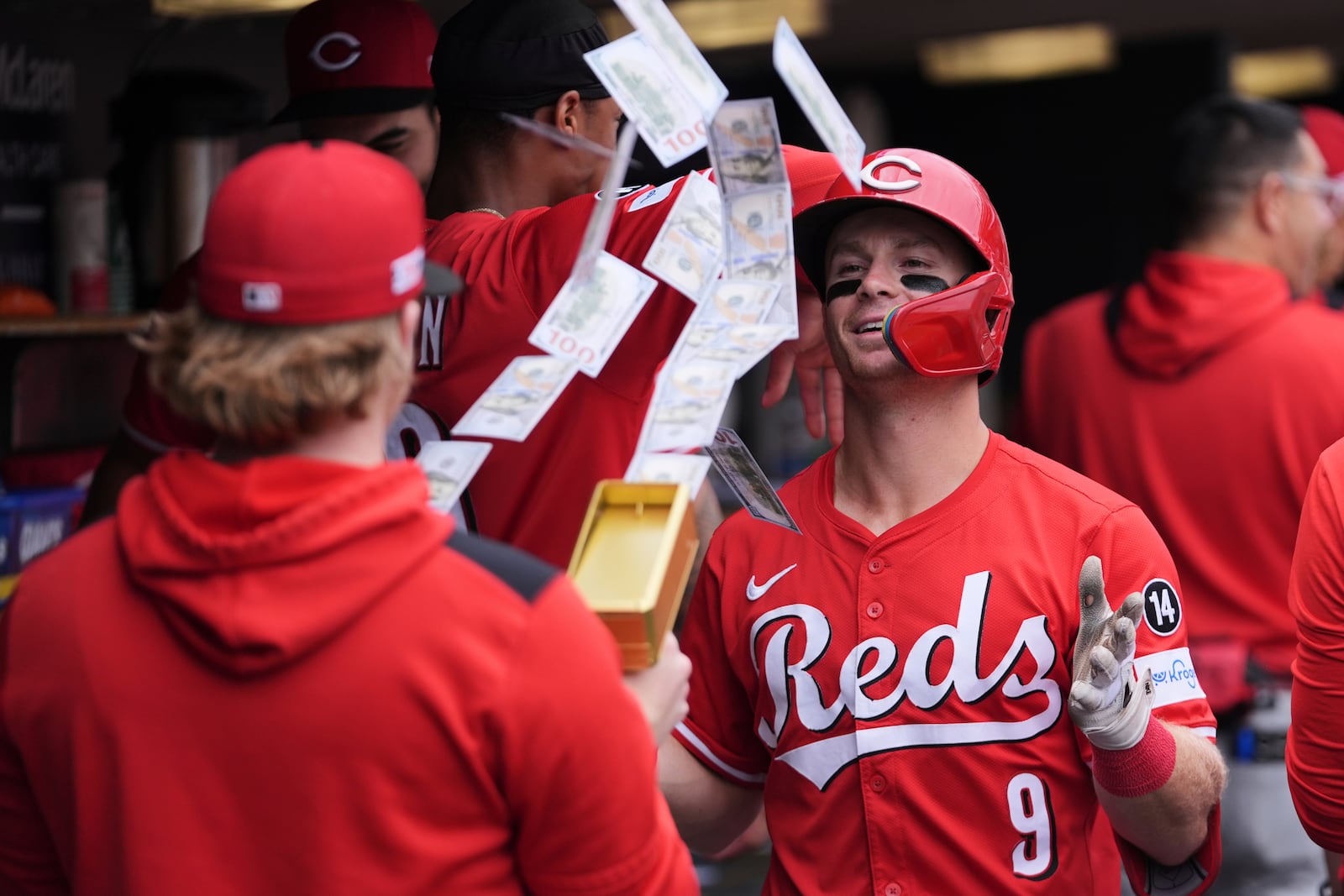 Cincinnati Reds' Matt McLain (9) celebrates his three-run home run against the Detroit Tigers in the eighth inning during a baseball game, Saturday, June 14, 2025, in Detroit. (AP Photo/Paul Sancya)