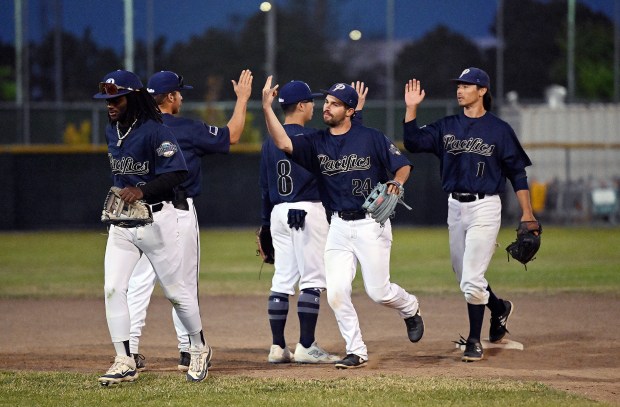 San Rafael Pacifics players celebrate after defeating the Martinez Sturgeon...