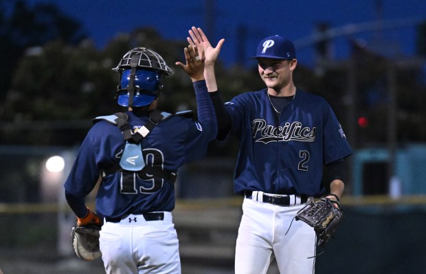 San Rafael Pacifics closer Josh Idell celebrates with catcher Payton...