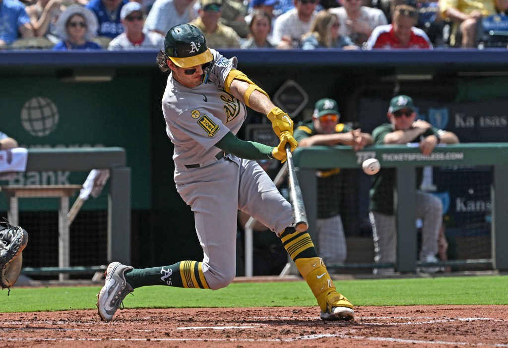 Athletics shortstop Jacob Wilson (5) singles in the third inning against the Kansas City Royals at Kauffman Stadium. 
