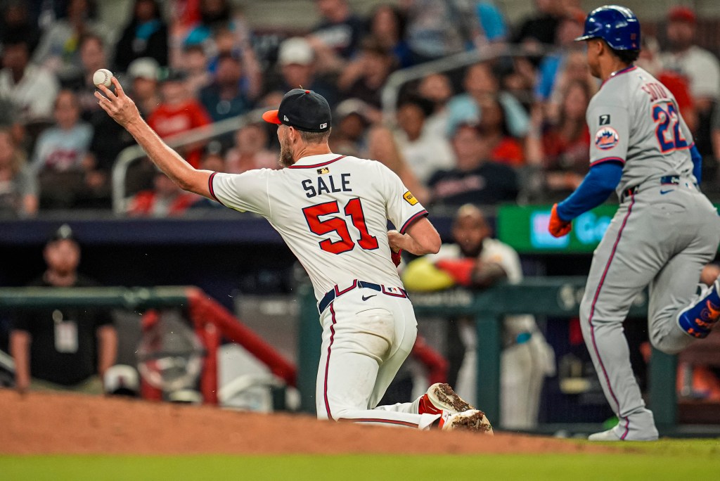 Atlanta Braves starting pitcher Chris Sale (51) throws out New York Mets right fielder Juan Soto (22) during the ninth inning at Truist Park. 
