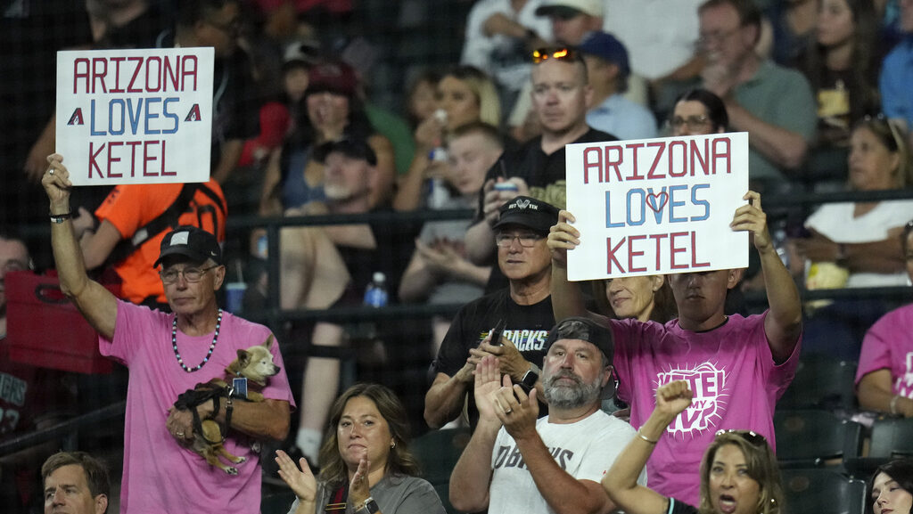 Arizona Diamondbacks fans cheer for Arizona Diamondbacks' Ketel Marte...