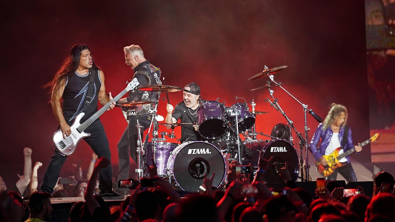 Robert Trujillo, from left, James Hetfield, Lars Ulrich, and Kirk Hammett of Metallica perform on Thursday, July 28, 2022, at Grant Park in Chicago. (Photo by Rob Grabowski/Invision/AP)