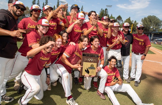 Estancia High School baseball team poses with the championship plaque after beating Marshall in the championship game of the CIF-SS Division 6 playoffs at Cal State Fullerton's Goodwin Field. (Photo by Sam Gangwer/Contributing Photographer)