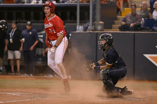 Mater Dei’s Brandon Thomas #34 celebrates scoring a run in...