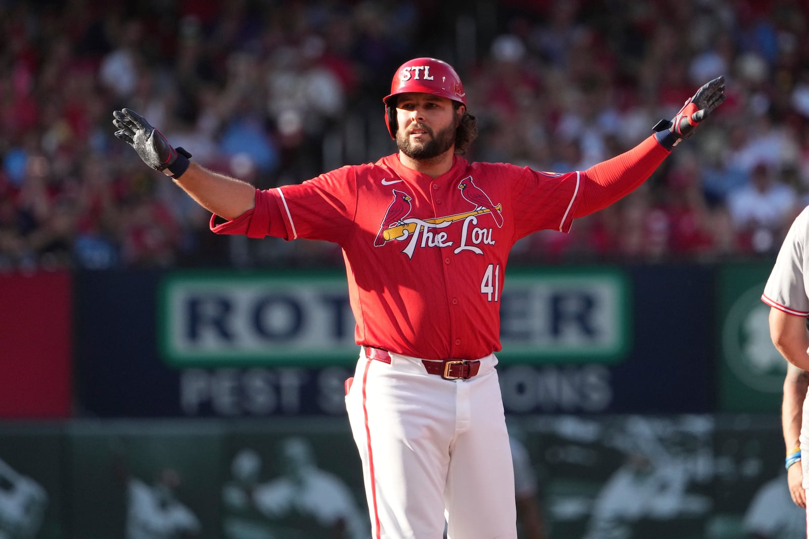 St. Louis Cardinals' Alec Burleson celebrates hitting a double during the first inning of a baseball game against the Cincinnati Reds Friday, June 20, 2025, in St. Louis. (AP Photo/Jeff Roberson)