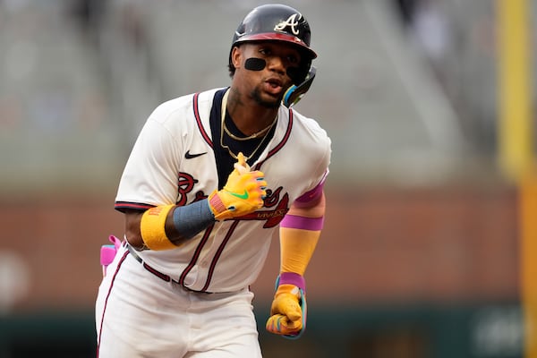 Atlanta Braves outfielder Ronald Acuña Jr. (13) celebrates his solo home run against the New York Mets in the first inning of a baseball game, Wednesday, June 18, 2025, in Atlanta. (AP Photo/Mike Stewart)