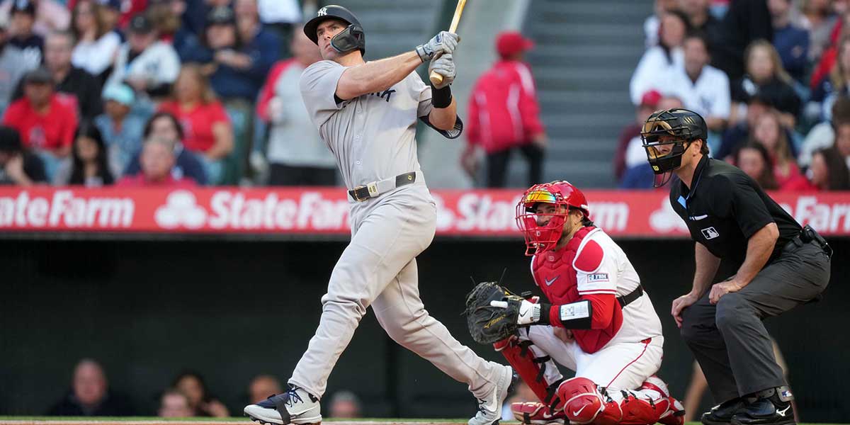 May 28, 2025; Anaheim, California, USA; New York Yankees first baseman Paul Goldschmidt (48) bats in the first inning as Los Angeles Angels catcher Travis d'Arnaud (25) and home plate Ben May watch at Angel Stadium.