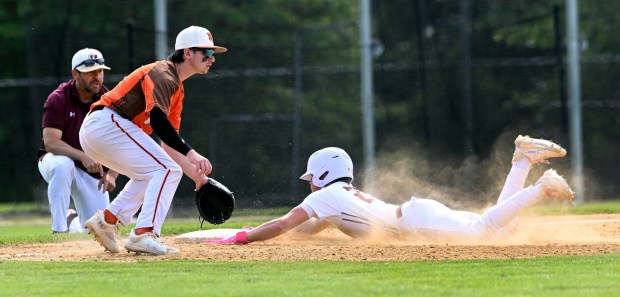 Gov. Mifflin's Travis Jenkins slides into third for a second-inning triple as coach Chris Hole looks on in a 6-1 opening round PIAA playoff victory over Pleasant Valley on Monday, June 2, 2025, at Rulon Griffith Field. jenkins was 3 for 4 with a single, double and triple. (BILL UHRICH/READING EAGLE)