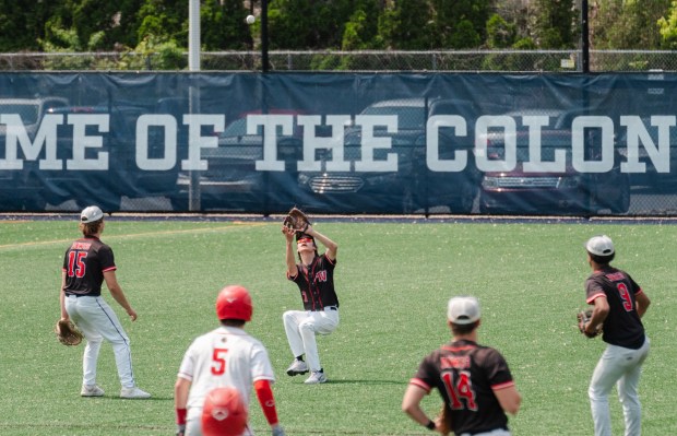 Tri-Valley junior Gavin Scheib (7) catches a fly ball as...
