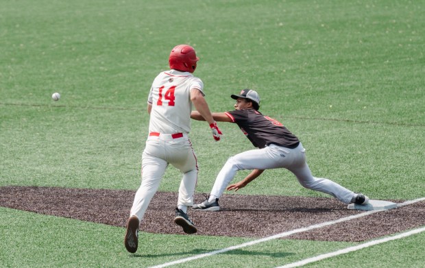 Tri-Valley sophomore Trey Porter (9) reaches out for the throw...