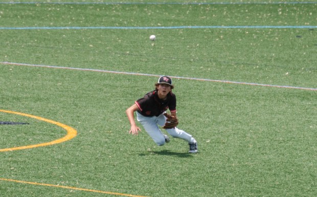 Tri-Valley senior Dawson Neugard (4) dives for the ball as...