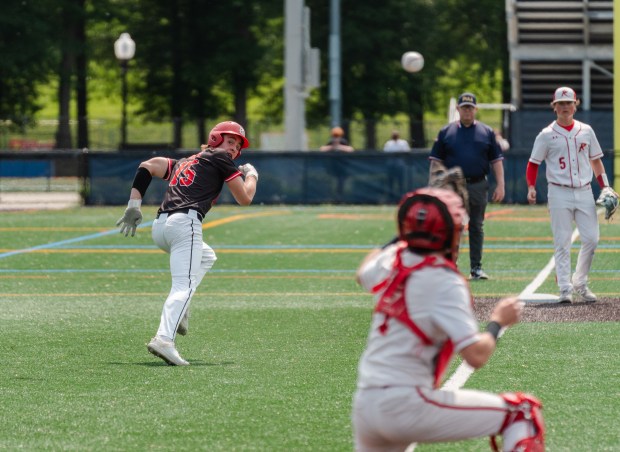 Tri-Valley junior Gavin Klock (15) runs back to third base...