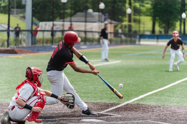 Tri-Valley sophomore Trey Porter (9) makes contact as Tri-Valley faces...