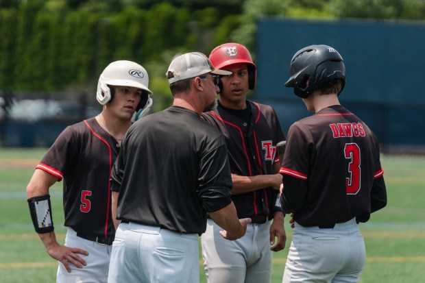 Tri-Valley head coach Brent Smith talks with Tri-Valley freshman Parker...