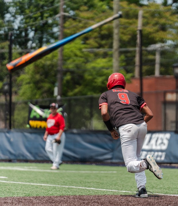 Tri-Valley sophomore Trey Porter (9) tosses his bat behind him...