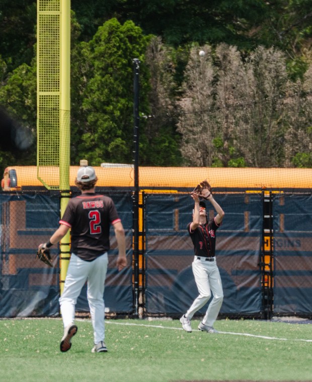 Tri-Valley junior Gavin Scheib (7) catches a fly ball as...
