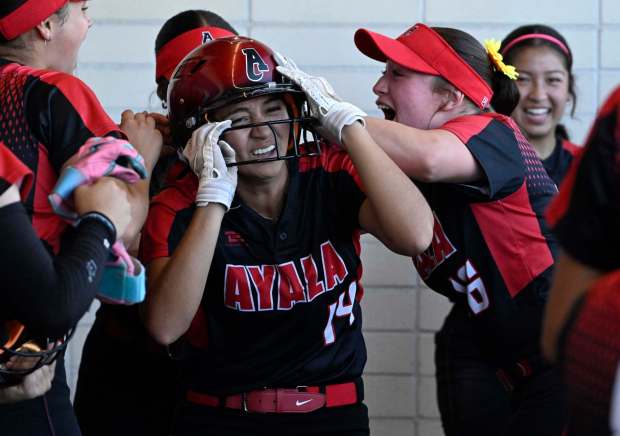 Zoey Hipolito #14 of Ayala celebrates in the dugout after scoring on a RBI double by teammate Jocelyn Escobedo (not pictured) against La Mirada in the sixth inning of a Division 1 softball quarterfinals game at La Mirada High School in La Mirada on Wednesday, May 21, 2025. (Photo by Keith Birmingham, Orange County Register/ SCNG)