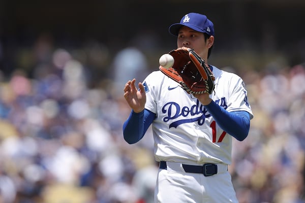 Los Angeles Dodgers starting pitcher Shohei Ohtani catches the ball during the first inning of a baseball game against the Washington Nationals in Los Angeles, Sunday, June 22, 2025. (AP Photo/Jessie Alcheh)