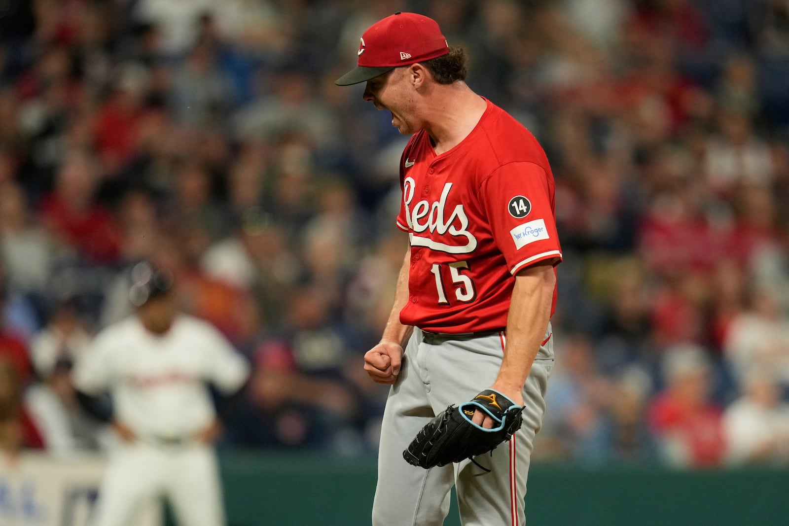 Cincinnati Reds relief pitcher Emilio Pagan (15) pumps his fist and shouts after the Reds defeated the Cleveland Guardians in a baseball game in Cleveland, Monday, June 9, 2025. (AP Photo/Sue Ogrocki)