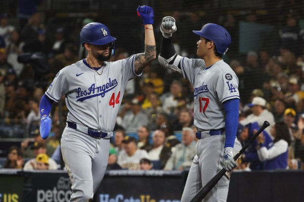 The Dodgers' Andy Pages and Shohei Ohtani celebrate after a run scored against the San Diego Padres at Petco Park on Monday, June 9, 2025 in San Diego, CA. (Meg McLaughlin / The San Diego Union-Tribune)