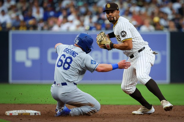 San Diego Padres' Xander Bogaerts tags out Los Angeles Dodgers' Dalton Rushing during the third inning at Petco Park on Tuesday, June 10, 2025 in San Diego, CA. (Meg McLaughlin / The San Diego Union-Tribune)