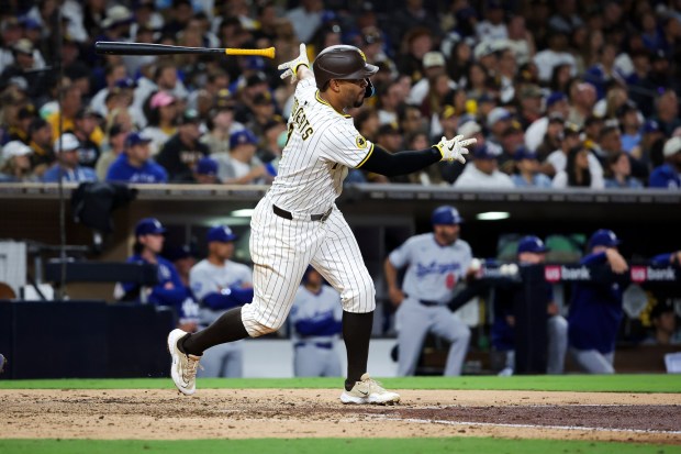 San Diego Padres' Xander Bogaerts drops his bat after a single against the Los Angeles Dodgers during the sixth inning at Petco Park on Tuesday, June 10, 2025 in San Diego, CA. (Meg McLaughlin / The San Diego Union-Tribune)