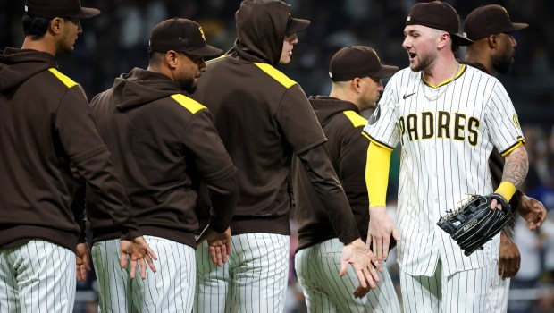 San Diego Padres' Jackson Merrill high fives teammates after the Padres beat the Dodgers at Petco Park on Tuesday, June 10, 2025 in San Diego, CA. (Meg McLaughlin / The San Diego Union-Tribune)