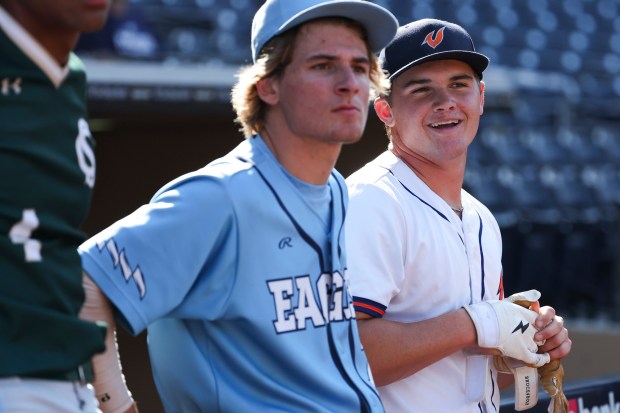 Valhalla catcher Mace Wheeler, right, smiles after participating in the home run derby as part of the CIF San Diego Section at the Padres High School All-Star Night at  Petco Park on Wednesday, June 25, 2025 in San Diego, CA. (Meg McLaughlin / The San Diego Union-Tribune)