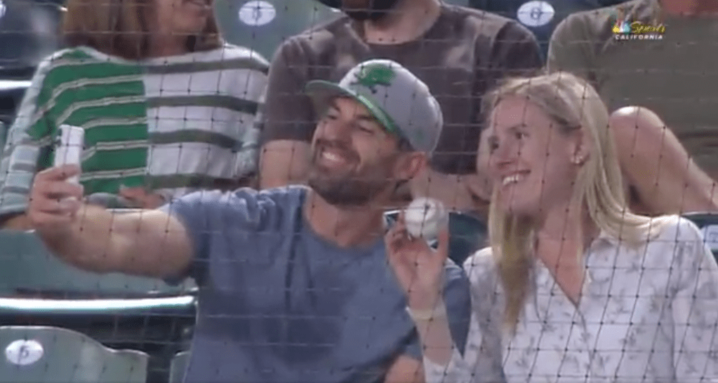 Not only did this fan come away with the foul, but she got the picture to prove it.