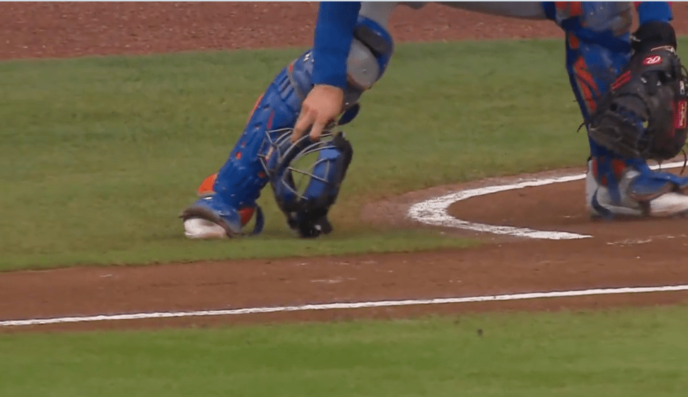 Torrens used his mask to go for the ball and was called for a balk.