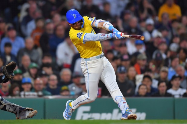 Boston Red Sox's Trevor Story hits a one-run double to allow Carlos Narváez to score in the fourth inning of a game against the New York Yankees. (AP Photo/Steven Senne)