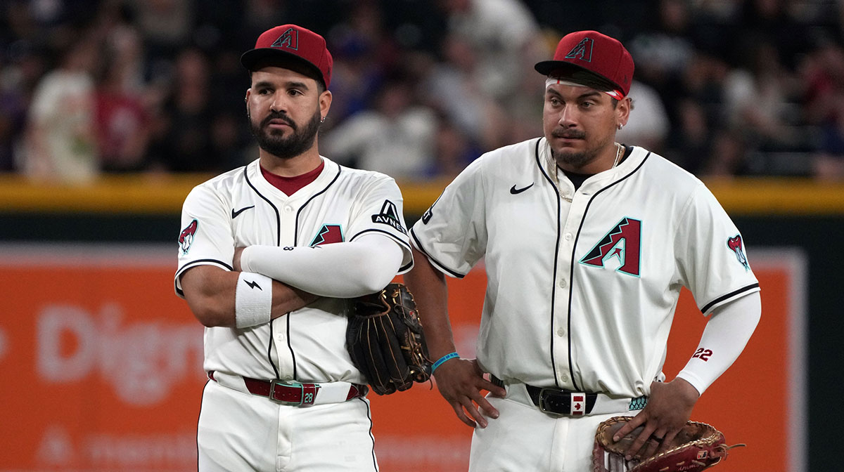 Jun 9, 2025; Phoenix, Arizona, USA; Arizona Diamondbacks third base Eugenio Suarez (28) and first base Josh Naylor (22) talk in the ninth inning against the Seattle Mariners at Chase Field. 