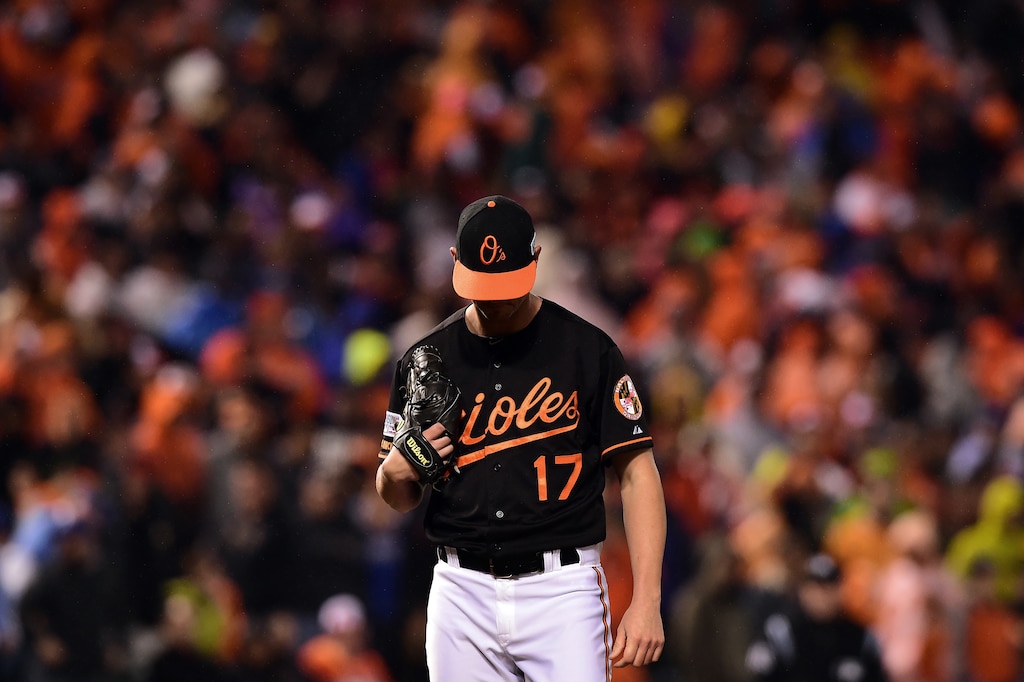 BALTIMORE, MD - OCTOBER 10: Brian Matusz #17 of the Baltimore Orioles reacts after Mike Moustakas #8 of the Kansas City Royals hit a two run home run to right center field in the tenth inning during Game One of the American League Championship Series at Oriole Park at Camden Yards on October 10, 2014 in Baltimore, Maryland.