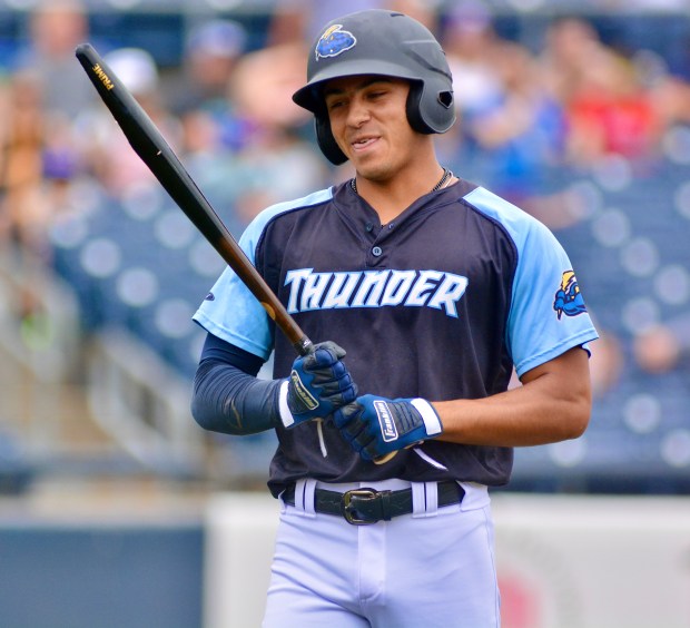 Thunder’s Aaron Whitley smiles as he looks at his bat...