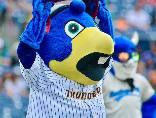 Thunder mascot Boomer looks at the video board for a...