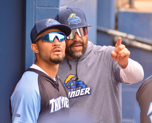 Thunder manager Shawn Chacon, right, talks with right fielder Jaden...