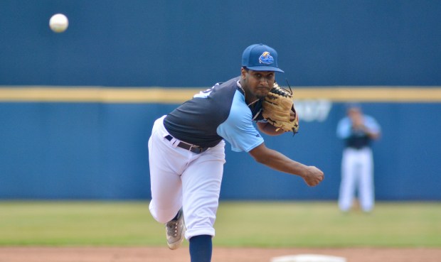 Thunder relief pitcher Paulo Noris throws to the plate against...
