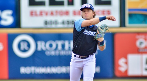 Thunder second baseman Rowan Masse throws the ball to first...