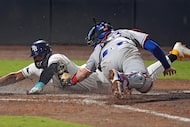 Tampa Bay Rays' Junior Caminero scores the game-winning run past Texas Rangers catcher Jonah...