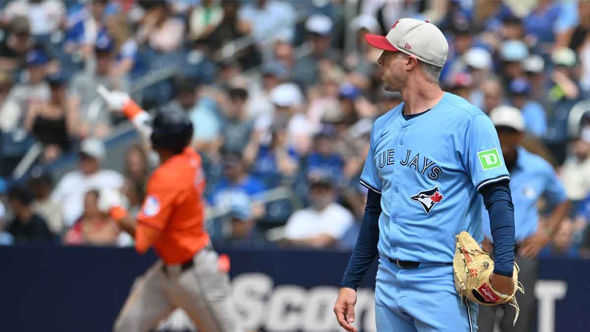 Jul 4, 2024; Toronto, Ontario, CAN; Toronto Blue Jays relief pitcher Trevor Richards looks on as Houston Astros shortstop Jeremy Pena (3) rounds the bases after hitting a solo home run in the seventh inning at Rogers Centre. 