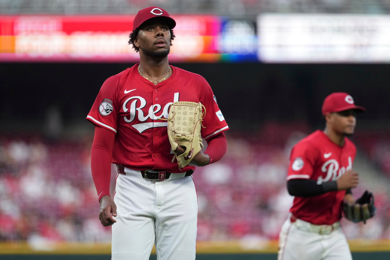 Cincinnati Reds' Hunter Greene walks to the dugout in the fifth inning of a baseball game against the Milwaukee Brewers, Tuesday, June 3, 2025, in Cincinnati. (AP Photo/Kareem Elgazzar)
