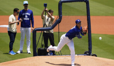 Los Angeles Dodgers' pitcher Shohei Ohtani, center, throws live batting practice as pitching coach ...