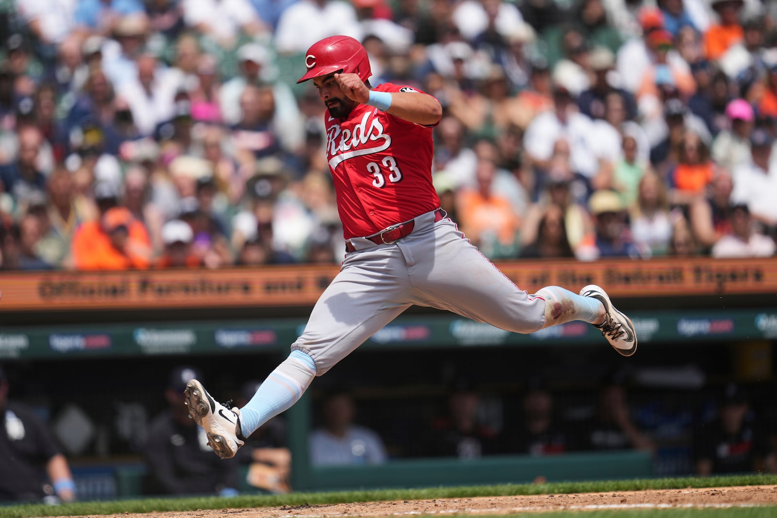 Cincinnati Reds' Christian Encarnacion-Strand scores on a Detroit Tigers pitcher Will Vest wild pitch in the eighth inning during a baseball game, Sunday, June 15, 2025, in Detroit. (AP Photo/Paul Sancya)