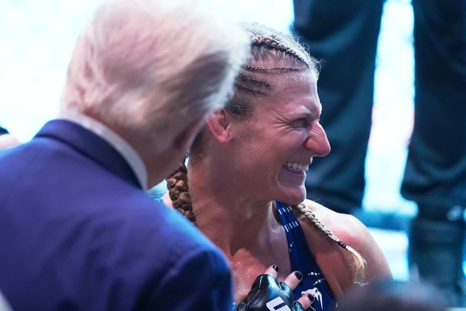 President Donald Trump congratulates Kayla Harrison after winning her women's bantamweight bout against Julianna Pena during the UFC-316 mixed martial arts event, at the Prudential Center, Saturday, June 7, 2025, in Newark, N.J. (AP Photo/Manuel Ceneta)