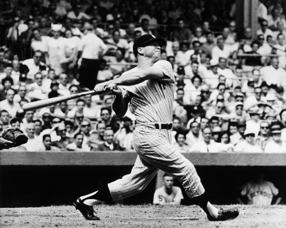 Mickey Mantle hitting a home run at Yankee Stadium.
